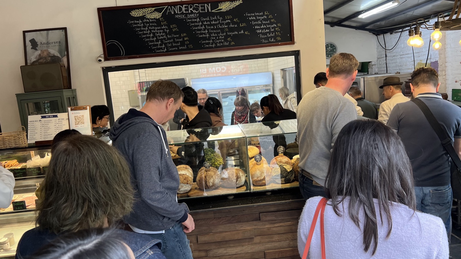 German bakery delegates visiting the bread counter and bakery interior at Andersen Nordic Bakery