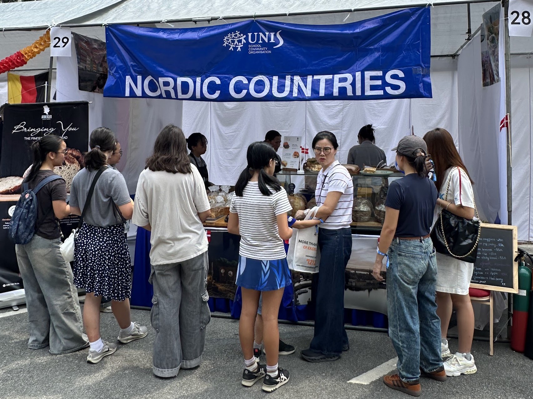 Visitors at the Andersen counter under the Nordic Countries sign at UNIS Hanoi Spring Fair 2026